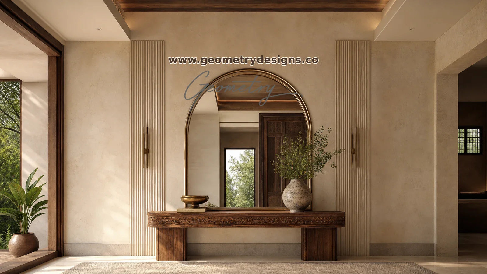 Geometry Designs architectural statement mirror above a carved console in a modern Indian luxury entryway, with real Geometry wordmark and www.geometrydesigns.co.