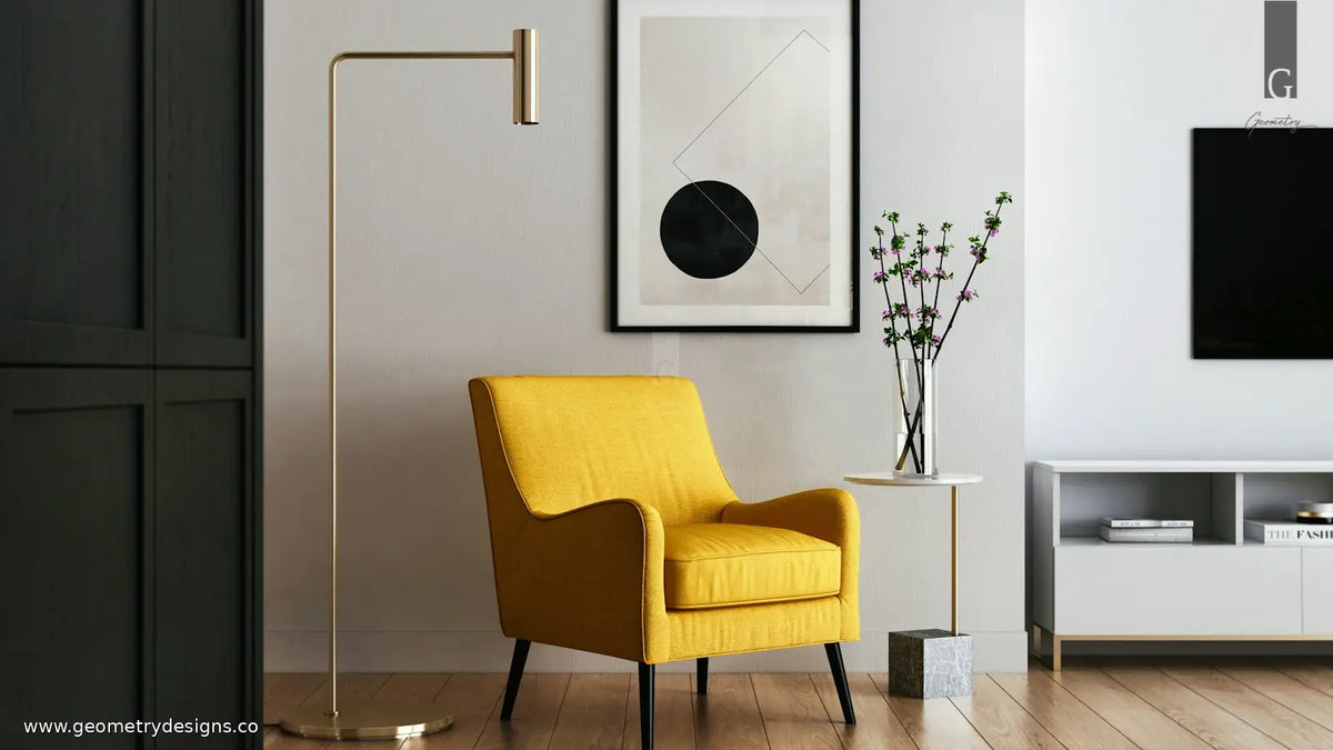 Contemporary Indian living room with a calm TV wall beside a sculptural handcrafted statement chair and soft layered lighting