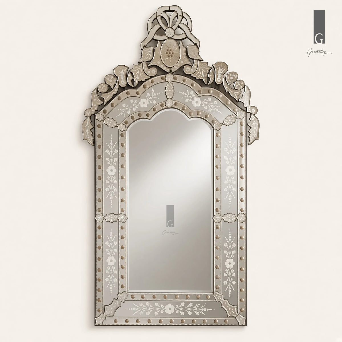 Geometry Designs Venetian Mirror in etched silver glass, shown in a straight front view on an ivory background.