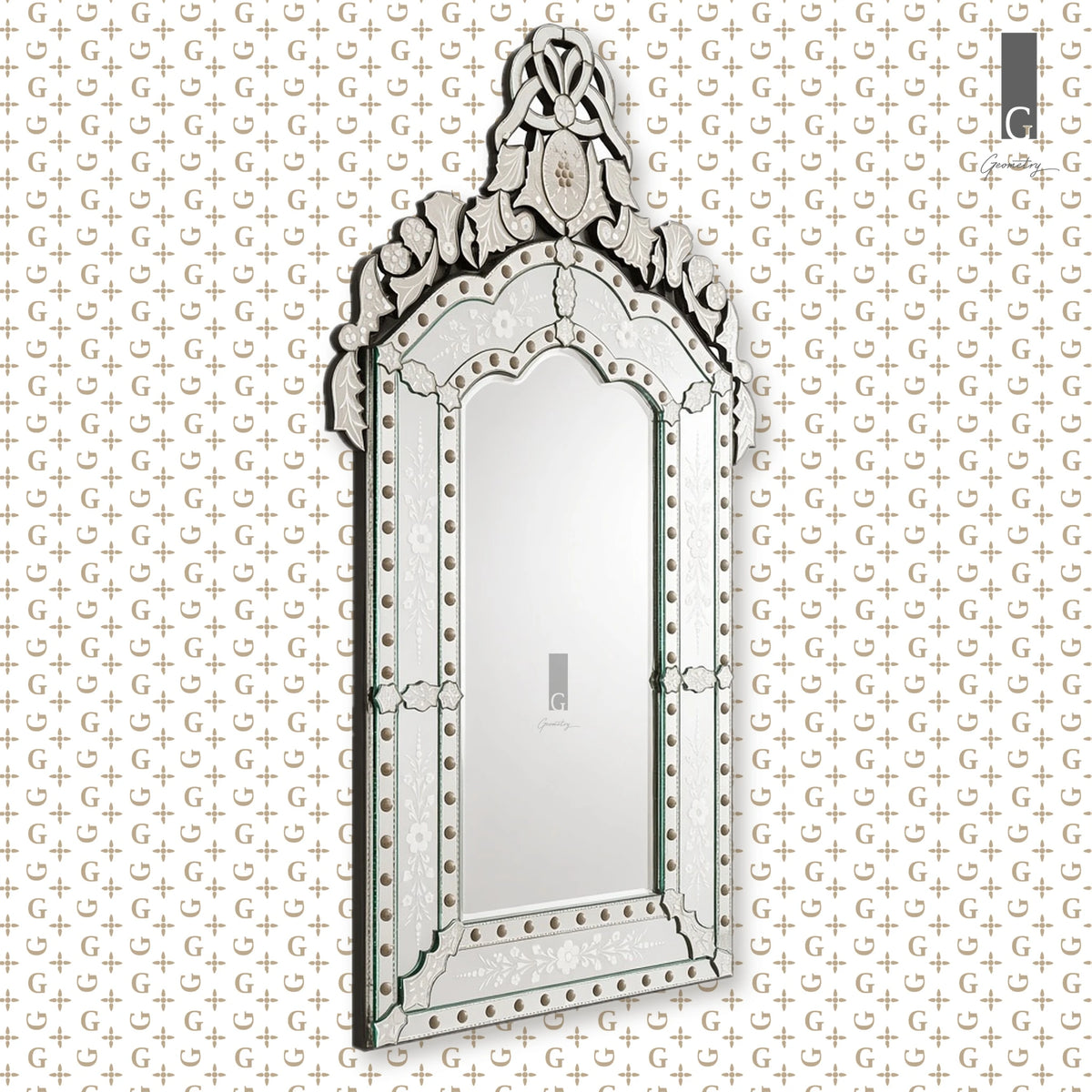 Geometry Designs Venetian Mirror in etched silver glass, shown at a side angle on the Geometry G-print background.