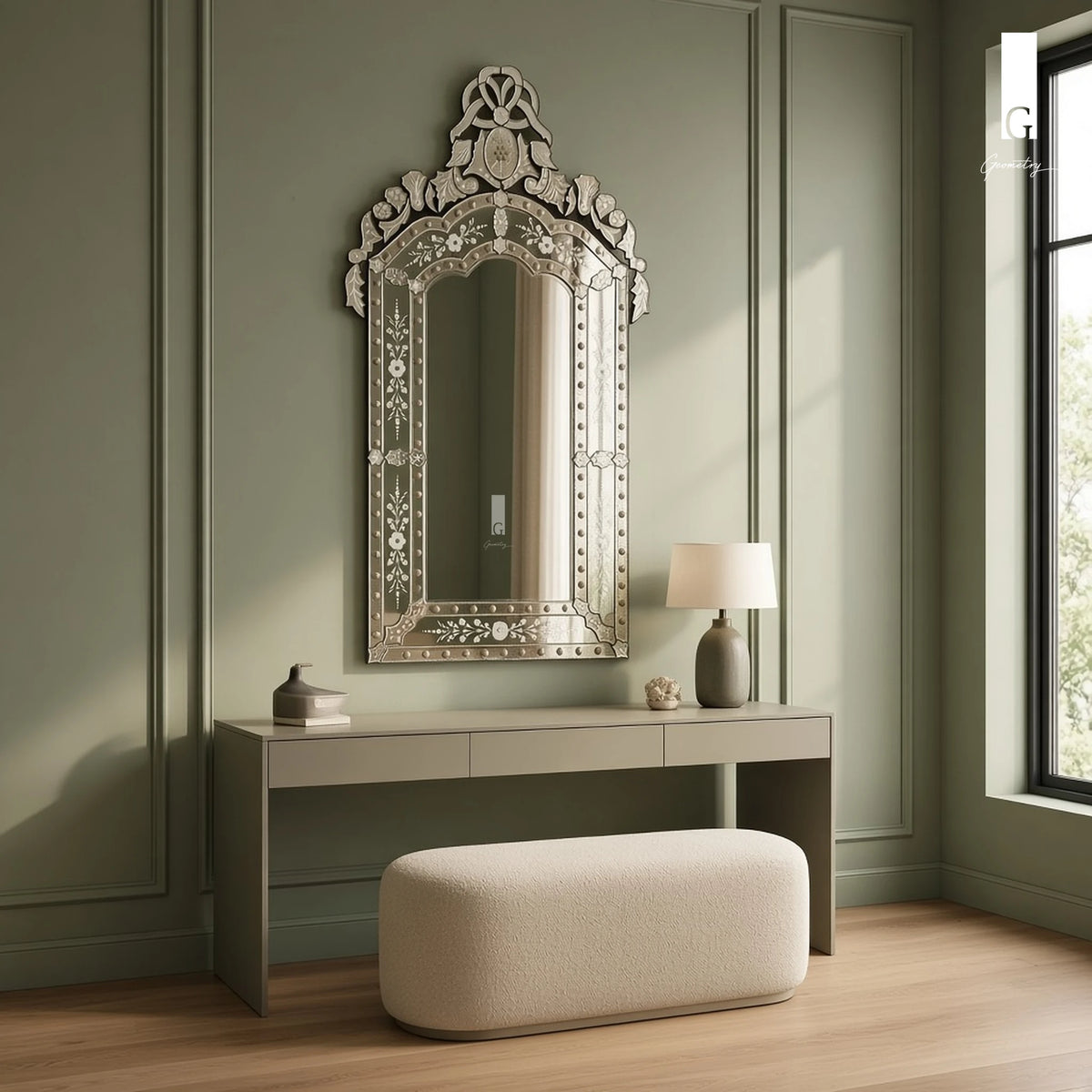 Geometry Designs Venetian Mirror in etched silver glass, shown above a dressing table in a sage-panelled contemporary bedroom.