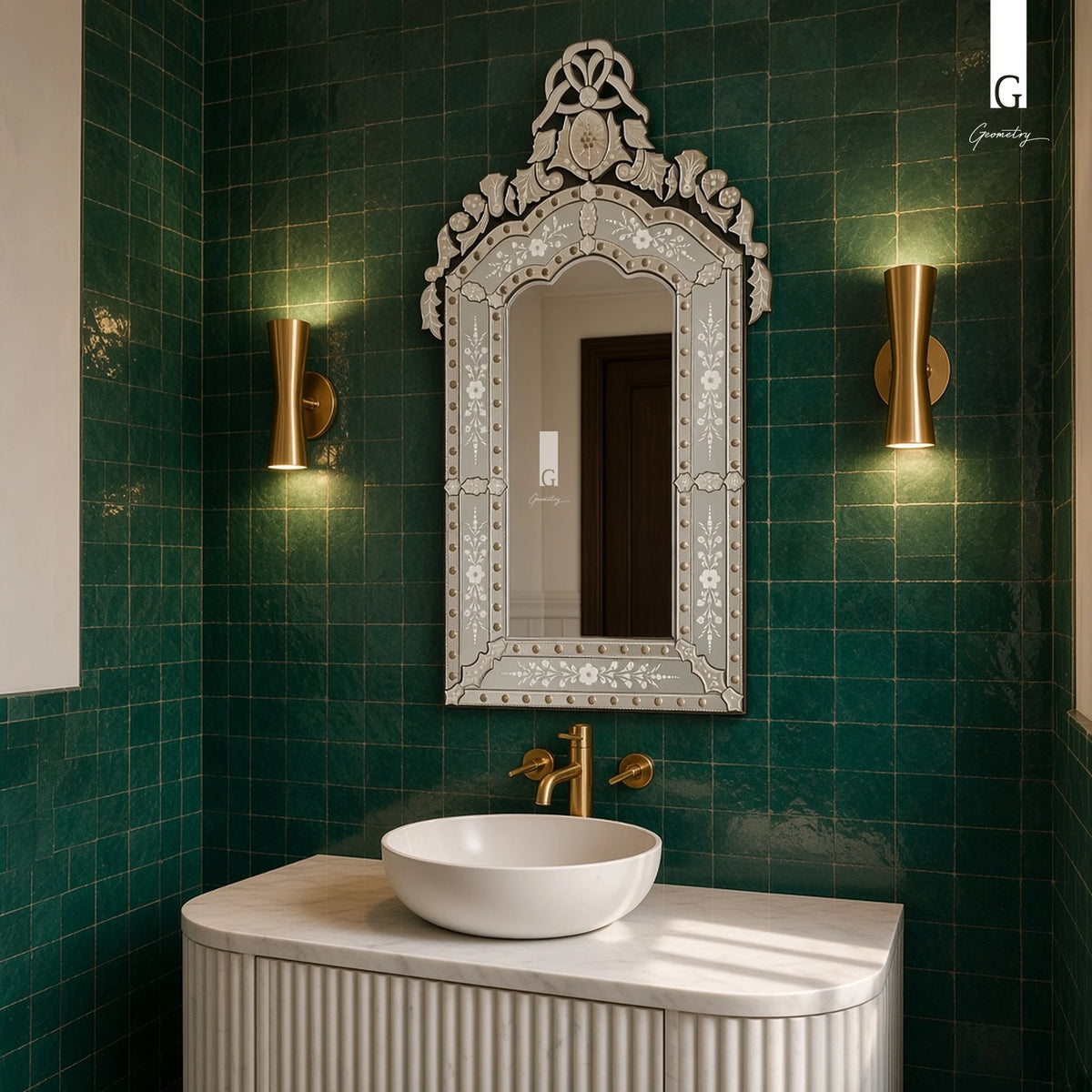 Geometry Designs Venetian Mirror in etched silver glass, shown above a fluted vanity in an emerald-tiled powder room.